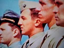 Does anyone recognize the marine in the middle, second from the left, in a  photo from the USS Franklin CV-13 after it was hit