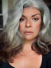 So I used photo one and ChatGPT made photo two with this prompt: Can you  create a high contrast portrait of my Face. Focusing