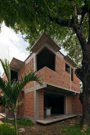 Como decorar la fachada de la casa de ladrillo. Casa Roja Arquine