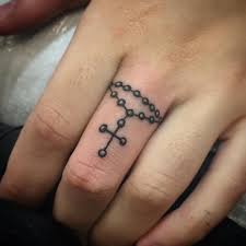 Tribal cross tattoo with wing 25 Rosary Cross Tattoos On Fingers