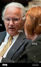 Kenrucky Sen. Walter Blevins, D-Morehead, talks with Denise Harper Angel,  D-Louisville, Thursday Jan. 19, 2012, during the General Assembly session  at the Capitol in Frankfort, Ky. Under a redistricting plan approved by