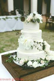 four tier white wedding cake flowers on wedding cake white and green wedding cak cak ca wedding cakes with flowers green wedding cake white wedding cakes