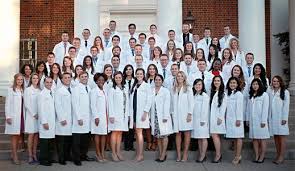 presents white coats to cl of 2019