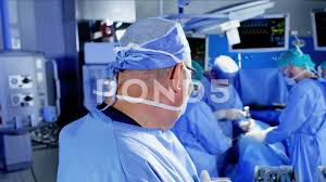 Portrait Of Surgeon Observing A Medical Hospital Specialist Team In Scrubs Stock Footage Medical Hospital Observing Portrait Medical Surgeon Portrait