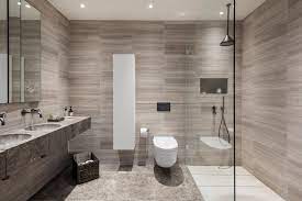 The trend of contemporary bathroom designs is scaled down, minimalist, highlighting warm, earthy tones. A Warm Modern Master Ensuite Contemporary Bathroom London By Via Asha Design Houzz