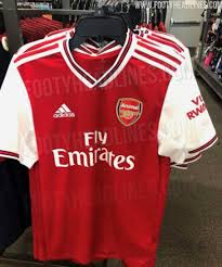 A navy crew neck collar is colour matched with navy adidas stripes on the shoulders and logo. Arsenal 2019 20 Home Kit More Photos Leaked Of Alexandre Lacazette Wearing New Adidas Shirt