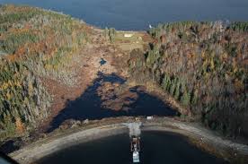 Who or when was digging through the swamp on Oak Island?