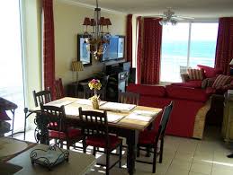 While you may think that you are limited due to the small space, a small dining table can actually create a stylish as well as practical dining room. Dining Room Wooden Dining Table Flower Vase Red Futon Dining Chair White Tiles Sofa Set Desk L Living Room Red Dining Room Design Living Room Dining Room Combo