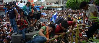 Thousands of migrants storm border to enter Mexico