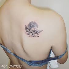 There are a lot of angel's shapes, ranking from a simple wing to full wings and hands. 50 Amazing Angel Tattoo Designs That Come With Powerful Meanings Angel Tattoo Designs Tattoo Models Cherub Tattoo