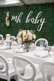 Boxwood wreath features small green leaves and a simple, round shape with a base of dark brown twigs. Blake S Surprise Baby Shower Monika Hibbs