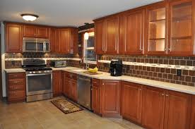 My New Kitchen Cherry Cabinets Ceramic Tile Floor And Solid Surface Countertop Kitchen Flooring Kitchen Design Kitchen Floor Tile
