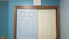 White doors, dark stained wood trim, and creamy white paint for elegance. Painted Interior Doors With Stained Trim