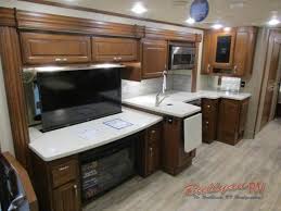 The kitchen in this class c motorhome has all the features needed on the road. Dynamax Dx3 37ts Diesel Class C Motorhome Bring More To The Road Bullyan Rvs Blog
