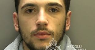 He only went to top up his mobile phone, then police swooped