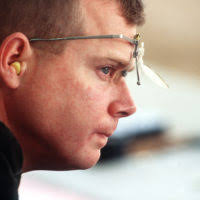 Right side profile, close-up as US Army Major Michael Anti holds his rifle  to his cheek and sights in his target Saturday, September 23rd, 2000 during  the Men's 50-meter Rifle 3 Position