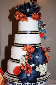 Navy blue on the accent pillows, bed skirts, and accessories anchor the color palette. Burgundy And Navy Blue Wedding Cakes Novocom Top