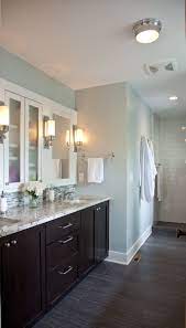 Concrete is also a good fit if it's moody enough, and wooden cabinets. Like The Floors Dark Vanity Tiles But With Full Mirror Wall Instead Decoration For House Bathroom Colors Wood Floor Bathroom Dark Bathrooms