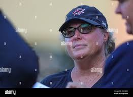 South Carolina head coach Beverly Smith meets with officials before an NCAA  softball game against UCF