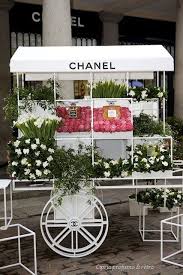 13 Things I Found On The Internet Today Vol Xiv Chanel Flower Flower Cart Flower Shop