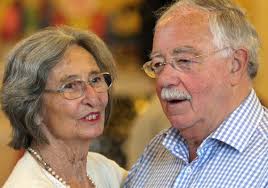 Dentist Malcolm Joyce has given the Alzheimer's Society a cheque for £1  million in memory of wife Jean