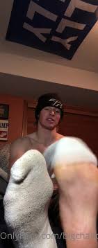 Bigchaddyb in socks and flexing his muscles on ThisVid.com