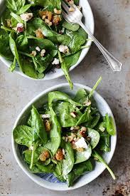 Wilted Spinach Salad With Hazelnuts Goat Cheese And Raisins Floating Kitchen Recipe Wilted Spinach Salad Spinach Salad Wilted Spinach