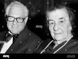 Former Israeli Prime Minister Golda Meir chats with Sam Rothberg of Peoria,  Ill., Sunday night, December 21, 1975 at an Israeli Bond Dinner in New  York. Some 1,700 Jewish Leaders gathered at