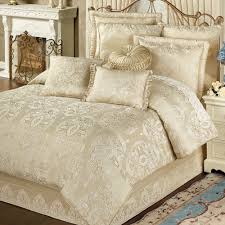 The set includes a bedspread and two shams, and it's available in full/queen or king/california king sizes. Francesca Light Gold Comforter Bedding Luxury Bedding Master Bedroom Bed Linens Luxury Luxury Bedding