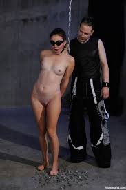 Naked female in a steamy suspension BDSM scene photos