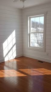 Better to use hardwood stained to match your laminate elsewhere or replace the carpet runner. Faux Shiplap Walls With Simple Window Trim And Wood Floors Thinking About This For The Li Small Bedroom Makeover White Wood Paneling Wood Paneling Living Room