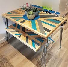 .a prominent dining table then we'll suggest you clone this diy pallet and old wooden beams dining table some single pallet slats a few old beams are the total supply material to install this precious you can plan any nice finish to gain a custom final look of the table! 25 Pallet Dining Tables That Inspire Your Crafting Digsdigs