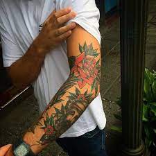 Top 59 Traditional Tattoo Sleeve Ideas 2021 Inspiration Guide Traditional Tattoo Sleeve Tattoos Rose Tattoos For Men