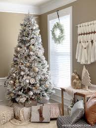 Here are best boho christmas decor ideas. Snowy Eclectic Bohemian Style Christmas Tree