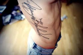 The words 'believe in yourself' are decoratively written and set on a bed of flourishing, languid strokes. 30 Cool Cursive Tattoo Fonts Ideas Hative