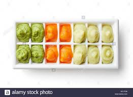 Pureed Baby Food In Ice Cube Trays Ready For Freezing Isolated On Stock Photo Alamy