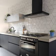 More dramatic shades of matt grey create instant impact, while the metallic shine of chrome and steel creates a clean, modern aesthetic. The White Kitchen Studio Coalitie Equipe Ceramicas