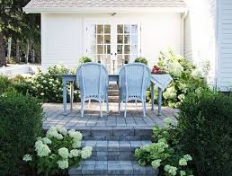 Charming White Picket Fence Paver Patio Wicker Chairs Limelight Hydrangea And Boxwoods Outdoor Dining Room Farmhouse Patio Patio Stones