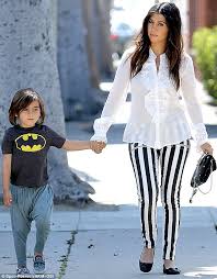 I love a wide leg pant, but it's so hard to find one that is truly oversized enough. Kourtney Kardashian Dons Striped Pants Reminiscent Of Beetlejuice As Son Mason Wears A Batman Shirt Daily Mail Online