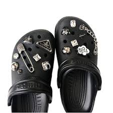 Bad bunny and crocs released clogs and jibbitz charms inspired by the rapper's album yhlqmdlg, and they sold out shortly after the crocs shoes are white and appear to change to a green hue, and they include jibbitz charms in the shape of stars. Crocs Charm Set Punk Style Designer Crocs Charms Pack Etsy Crocs Fashion Designer Crocs Girly Shoes