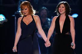 Take kelly clarkson , the winner of the first american idol, aired in 2002. Reba With Kelly Clarkson In 2002 Does He Love You Video