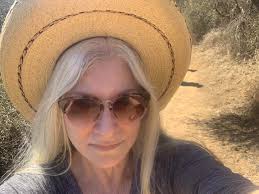 The last picture he took of us. Running through airports, rushed to get to  the next comic-con. He was one of the most brilliant shiny people I have  ever known. I wish