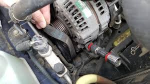 Walking it back and forth to aid in removal. How To Change The Serpentine Belt Toyota Sienna Practical Mechanic