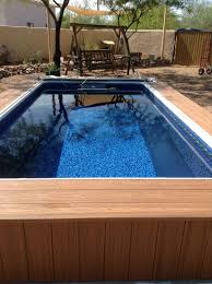 A Beautiful Backyard Endless Pool Installation With A Relaxing Bench Swing For Post Swim Leisure Endless Pool Pool Installation Beautiful Backyards