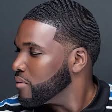 This fade haircut black men is an authentic fade haircut for men, where the sides are fade and the thick hair on the top blown up with a dryer. 30 Black Men Haircuts That Scream Style Menshaircutstyle