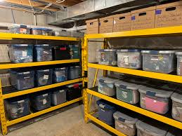 Storage progress at the parsonage! 🏠 Our big shelving units are assembled  and the totes are finding their new homes. Still a ways to go