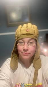 Mom my hat has a funny symbol, he calls out as I put his hats