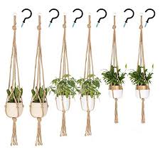 The macrame plant hanger trend seems to be going strong. Uusher Macrame Plant Hangers Hanging Plant Holder Indoor Outdoor Plain Simple Jute Rope Plants Hangers Set With 6 Hooks Handcraft For Boho Home Decor And Space Saving 6 Pcs 3 Sizes Buy