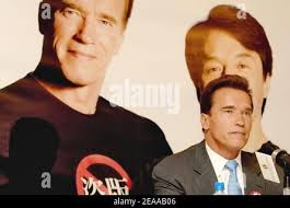 California Governor Arnold Schwarzenegger (R) presents a Purple Heart medal  to California Army National Guard Specialist Anastacio Lopez at the  Military Order of the Purple Heart national convention held at the Omni