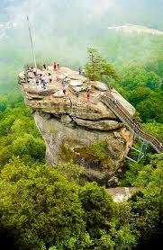 Chimney rock is both the name of a north carolina village and the large monolith that overlooks said village. Chimney Rock North Carolina Places To Visit Beautiful Places Places Around The World